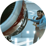 Two engineers assessing jet engine 